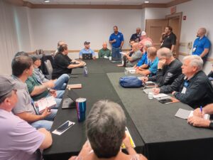 A group of people sitting around a table.