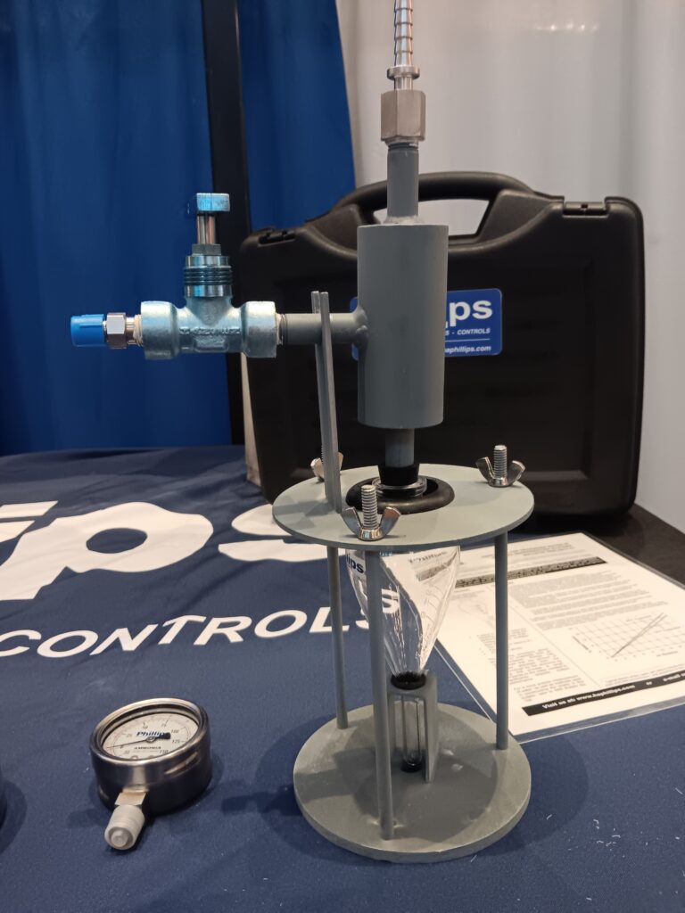 A water pump and meter on display at an event.