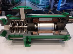 A green machine with many parts on it