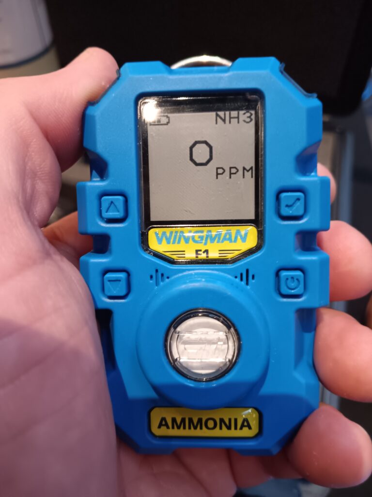 A person holding an electronic device in their hand.