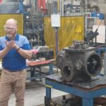 A man standing in front of a machine