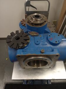 A blue and silver machine sitting on top of a table.