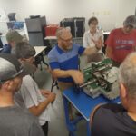 A group of people gathered around a table.