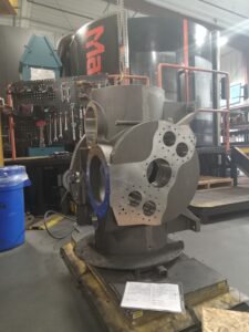 A large metal object sitting on top of a table.