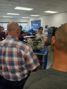A group of people sitting around in an office.